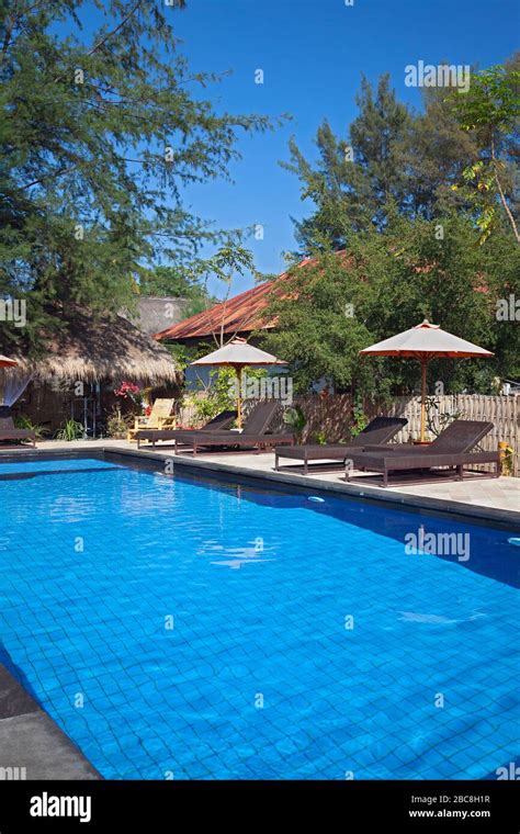 Asia, Indonesia, West Nusa Tenggara, Gili Air, Pool and Loungers at